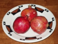 Pomegranates Perched on a Plate